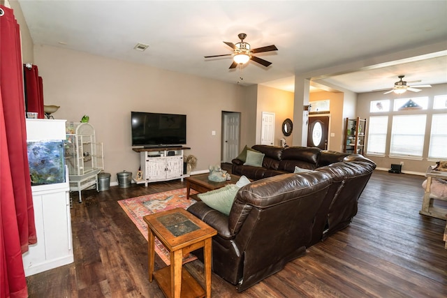 living room featuring dark hardwood / wood-style flooring and ceiling fan