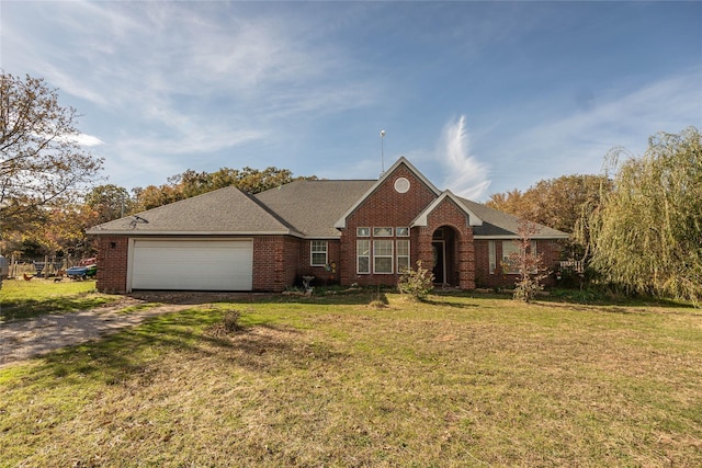 single story home with a front yard and a garage