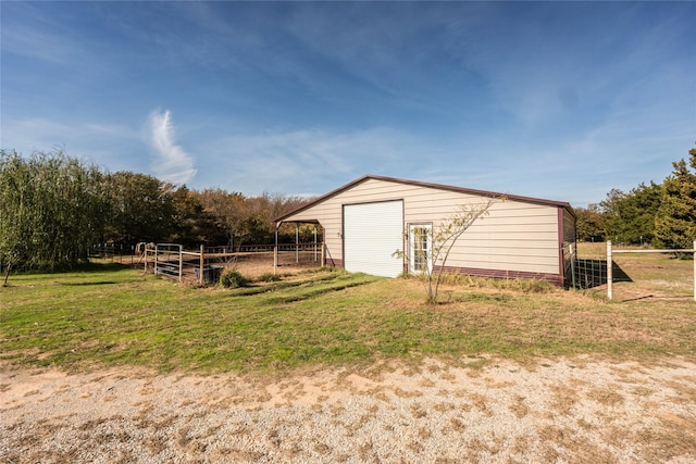 view of outdoor structure with a lawn