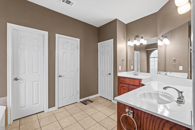 bathroom featuring tile patterned floors and vanity