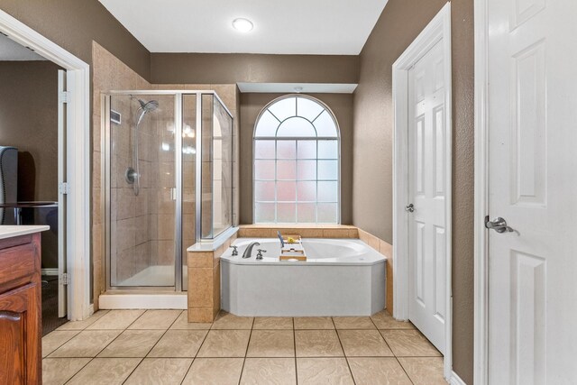 bathroom with tile patterned flooring and vanity