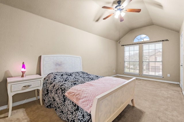 bedroom featuring light carpet, vaulted ceiling, and ceiling fan