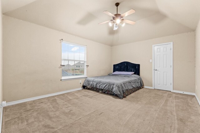 bedroom featuring ceiling fan, light colored carpet, and lofted ceiling