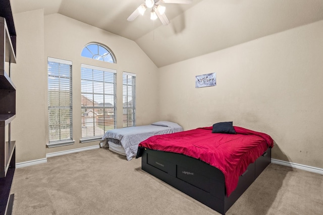 bedroom featuring ceiling fan, light colored carpet, and lofted ceiling