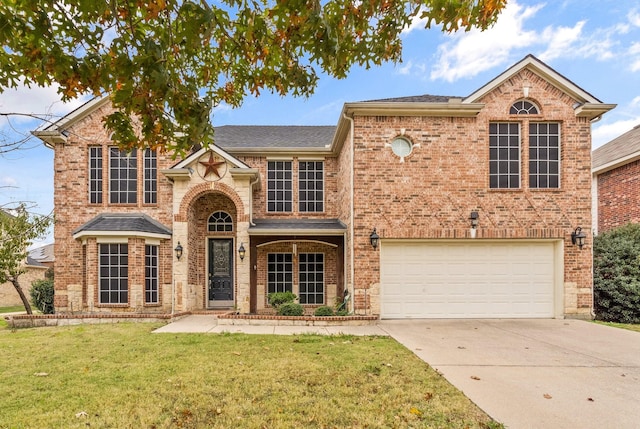 view of front property featuring a garage and a front lawn