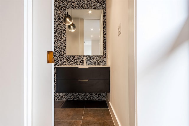 bathroom featuring tile patterned flooring and vanity