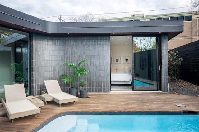 exterior space featuring a swimming pool side deck