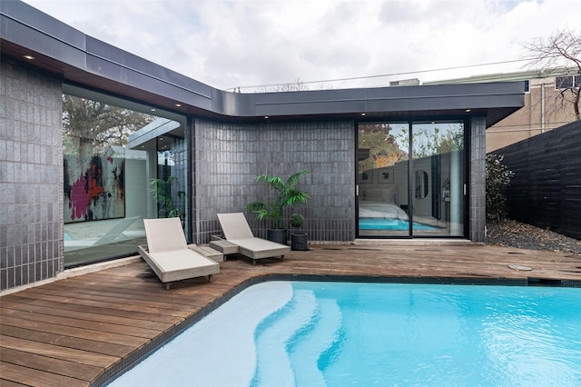 view of swimming pool featuring a deck