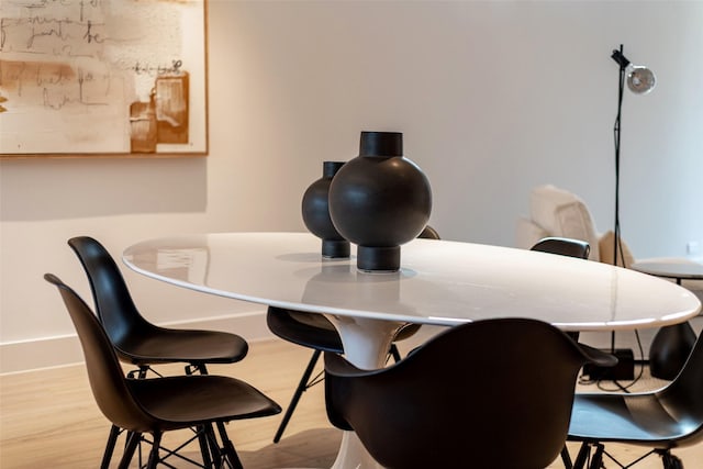 dining area with light hardwood / wood-style flooring