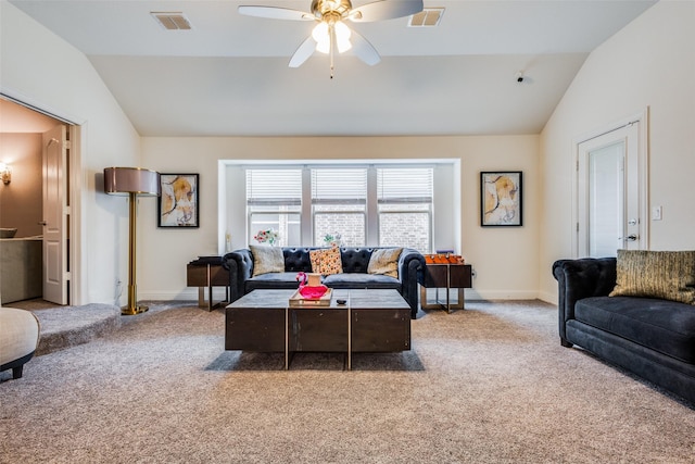 carpeted living room with ceiling fan and lofted ceiling