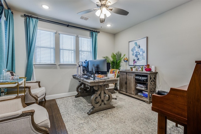 home office with hardwood / wood-style floors and ceiling fan