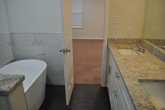 bathroom with a bathtub and vanity