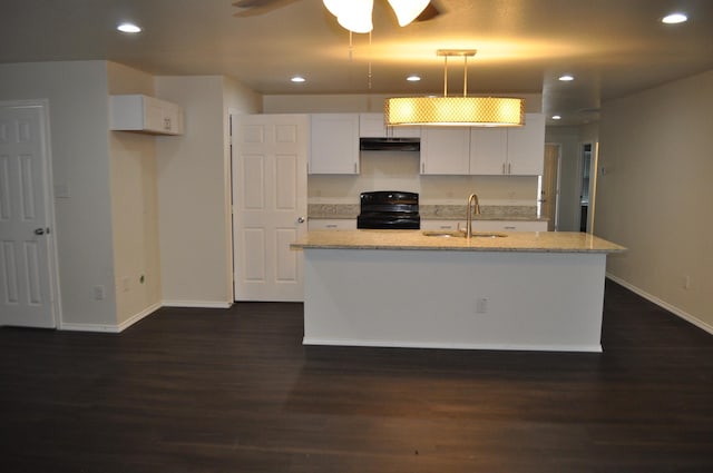 kitchen featuring black range oven, dark wood-type flooring, sink, decorative light fixtures, and white cabinetry