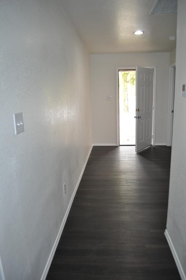 hallway featuring dark wood-type flooring