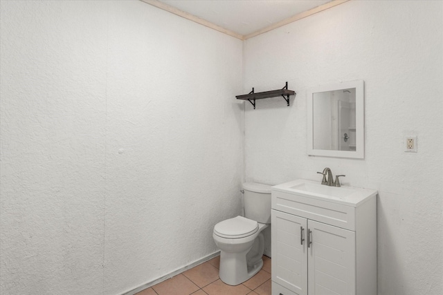 bathroom featuring tile patterned flooring, vanity, and toilet