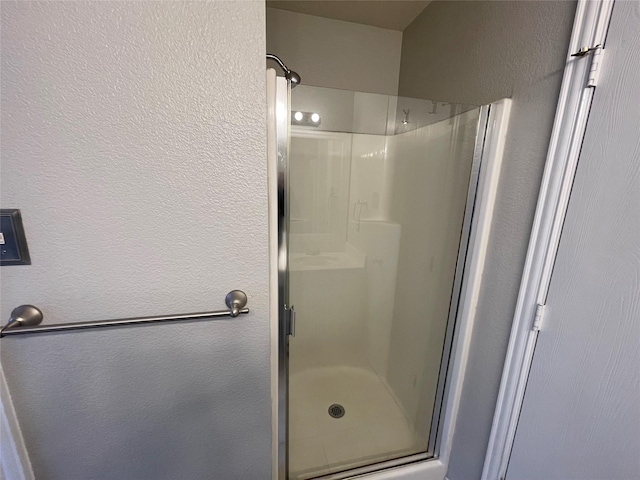 bathroom featuring an enclosed shower