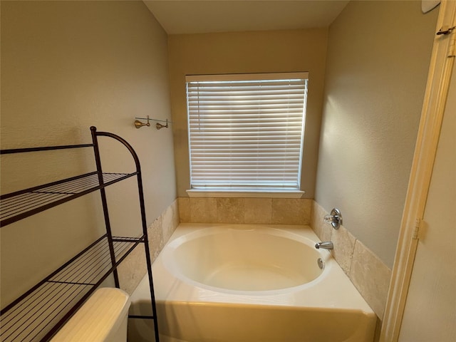 bathroom featuring a tub to relax in