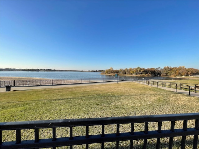 view of yard with a rural view and a water view