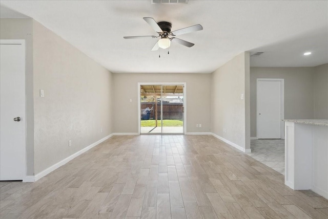 spare room with ceiling fan and light hardwood / wood-style flooring