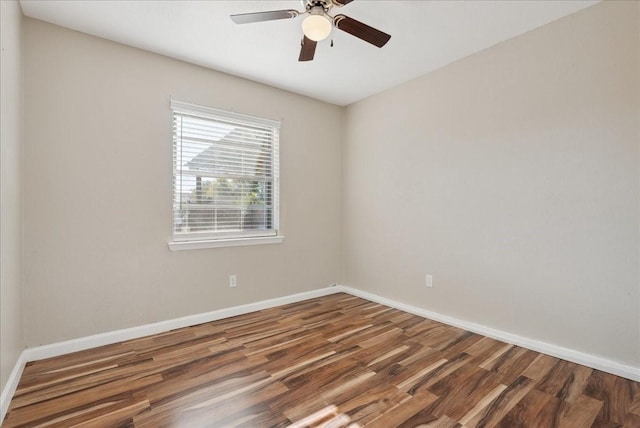 spare room featuring wood-type flooring and ceiling fan