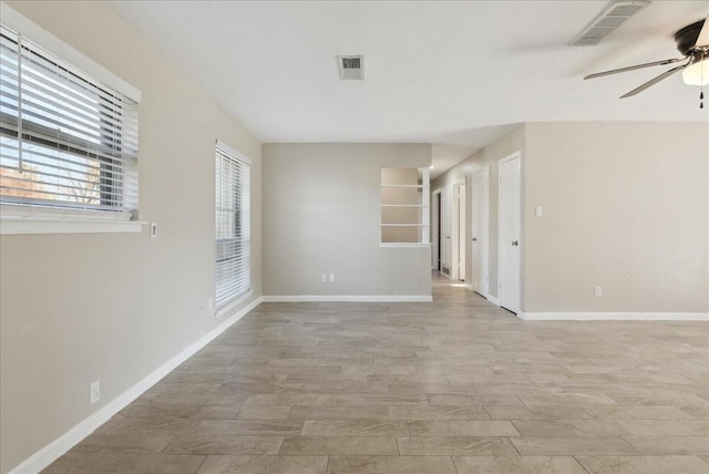 spare room with ceiling fan