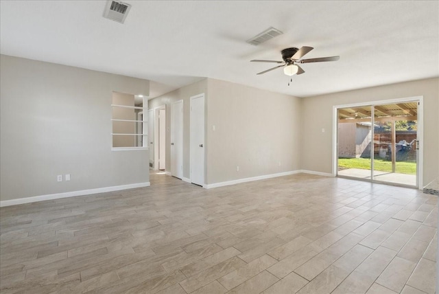 empty room with light hardwood / wood-style flooring and ceiling fan