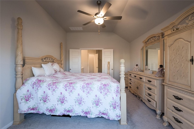 carpeted bedroom with ceiling fan and lofted ceiling