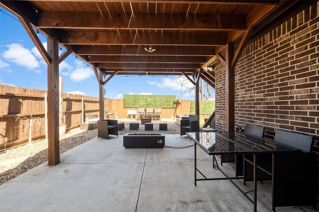 view of patio / terrace featuring an outdoor living space with a fire pit