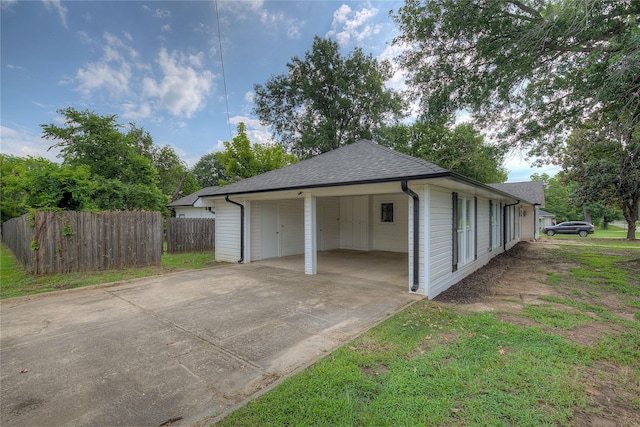 garage featuring a carport