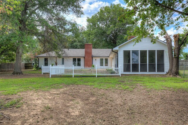 garage with concrete driveway and fence