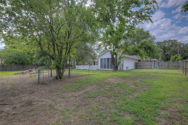 view of yard with a fenced backyard