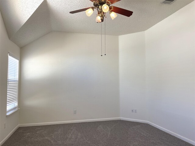 unfurnished living room with lofted ceiling, a tile fireplace, ceiling fan with notable chandelier, and light colored carpet