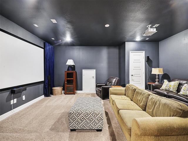 home theater with carpet and a textured ceiling