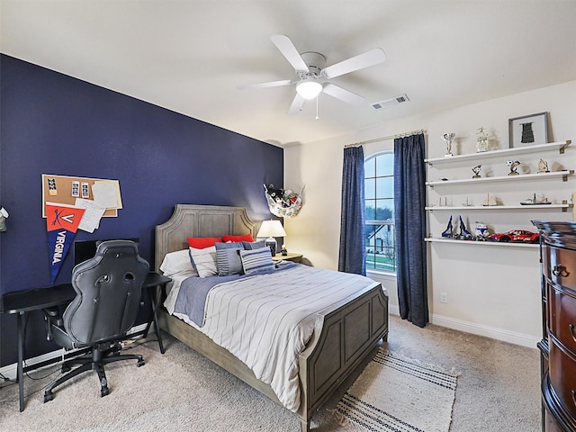 bedroom with ceiling fan and light carpet