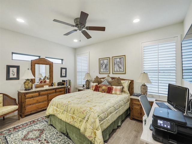 bedroom featuring ceiling fan and light hardwood / wood-style floors