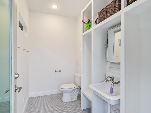 bathroom featuring tile patterned floors, sink, and toilet