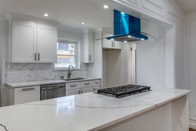 kitchen with white cabinets, light stone counters, sink, and appliances with stainless steel finishes