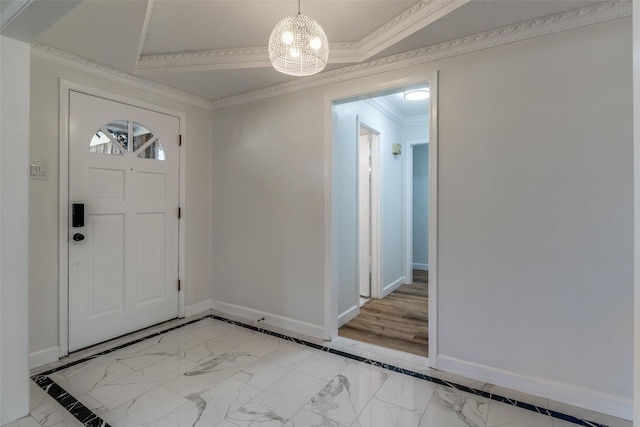 entryway featuring a notable chandelier and ornamental molding