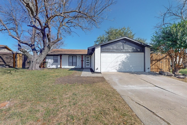 view of front of home featuring an attached garage, brick siding, fence, concrete driveway, and a front yard