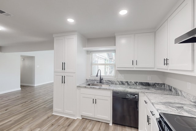 kitchen with visible vents, dishwasher, light wood-style flooring, wall chimney range hood, and a sink