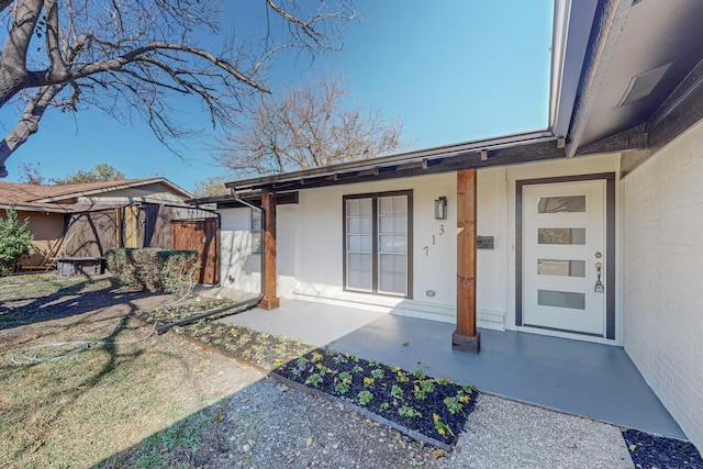 doorway to property with a porch