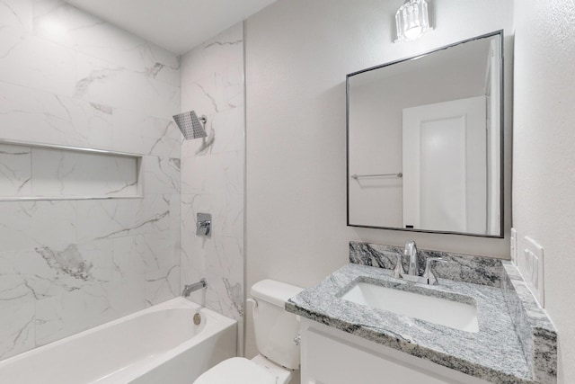 bathroom with shower / tub combination, vanity, and toilet