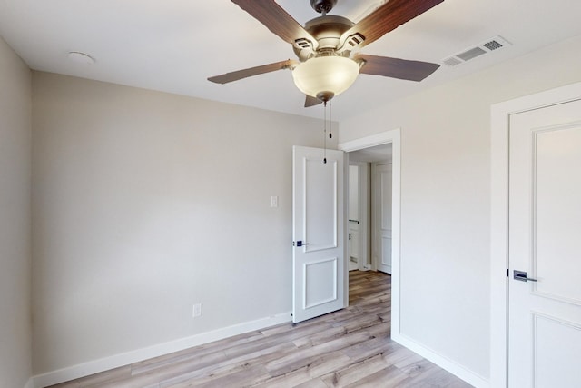 unfurnished bedroom with baseboards, ceiling fan, visible vents, and light wood-style floors