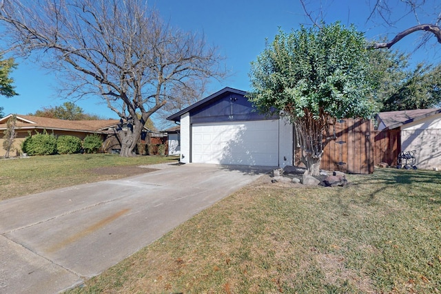 garage with concrete driveway