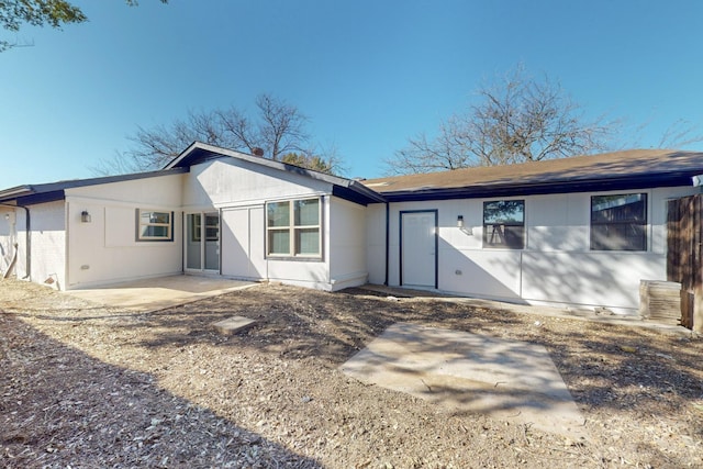 back of property with a patio area