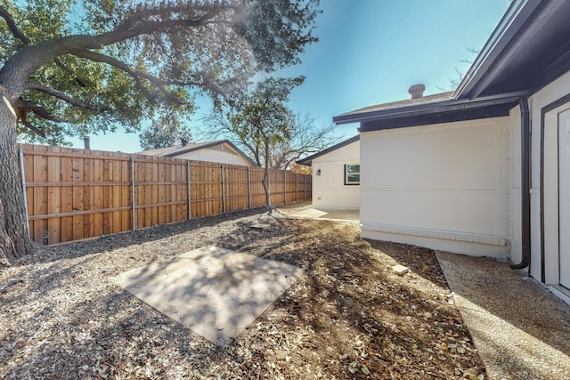 view of yard with a patio area and a fenced backyard