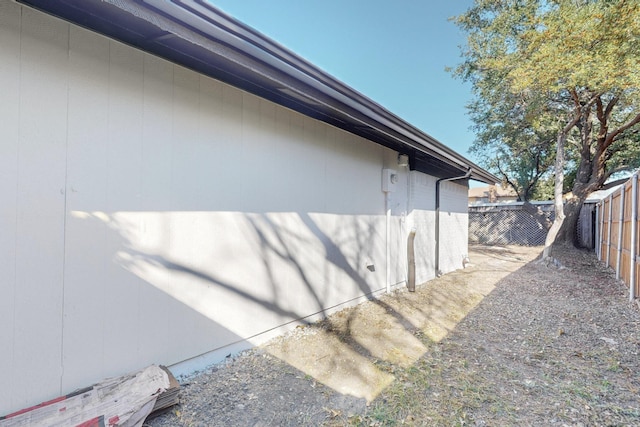 view of home's exterior featuring fence