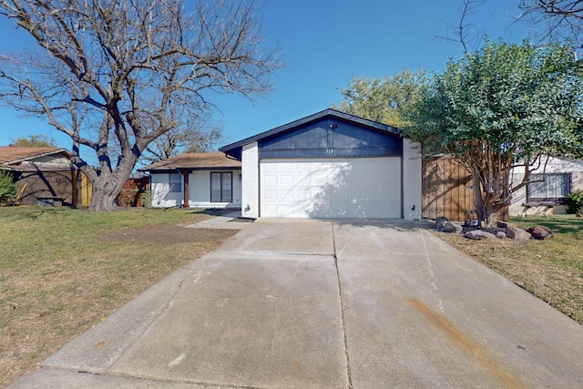 ranch-style house with driveway, a garage, a front lawn, and brick siding