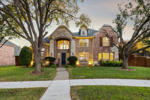 view of front of house with a lawn