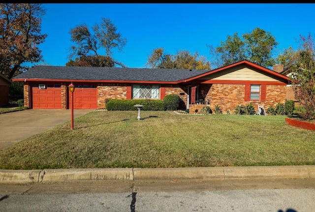 single story home with a garage and a front lawn